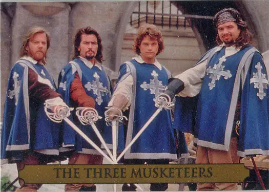 Four men in blue capes as Musketeers holding swords for Three Musketeers Movie Promo Card