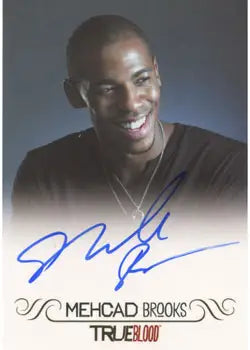 Signed Mehcad Brooks autograph card featuring a smiling man in a dark shirt
