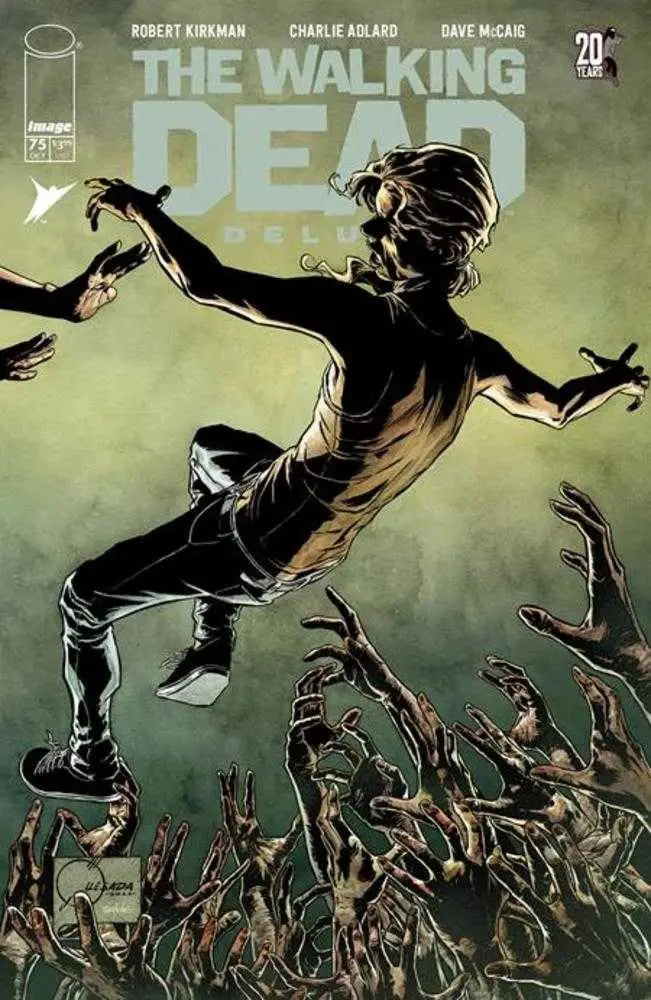 Comic book cover of Walking Dead Deluxe #75 with a figure leaping over zombies