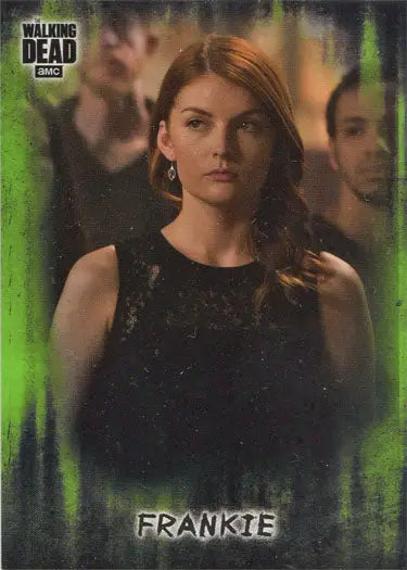 Woman with long reddish-brown hair in black top beside Walking Dead mold parallel card