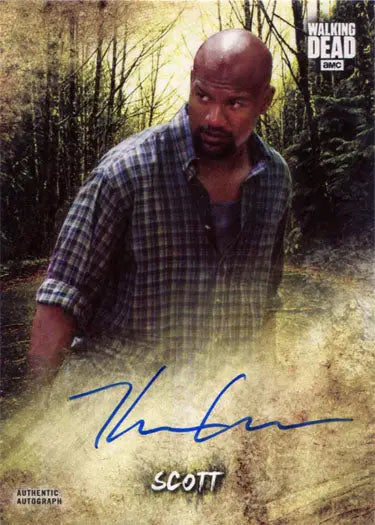 Autographed Kenric Green trading card featuring him in a plaid shirt in a forest