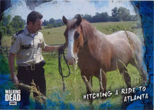 Uniformed officer beside a brown horse in a grassy field on a Walking Dead blue parallel card