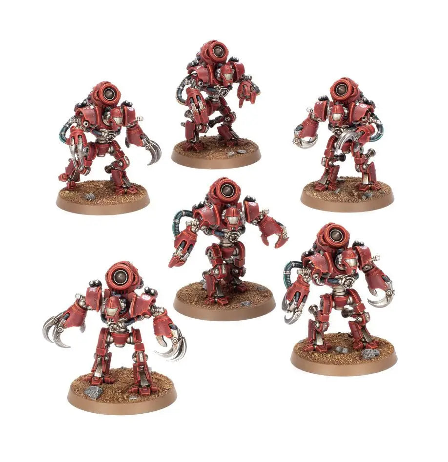 Six red robotic miniatures from Warhammer: MECHANICUM: URSARAX COHORT for trading cards