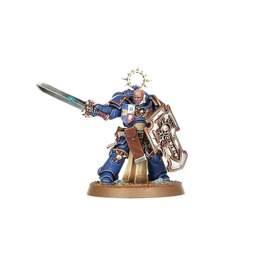 Blue and gold miniature Space Marines Bladeguard Veterans figure with sword and shield