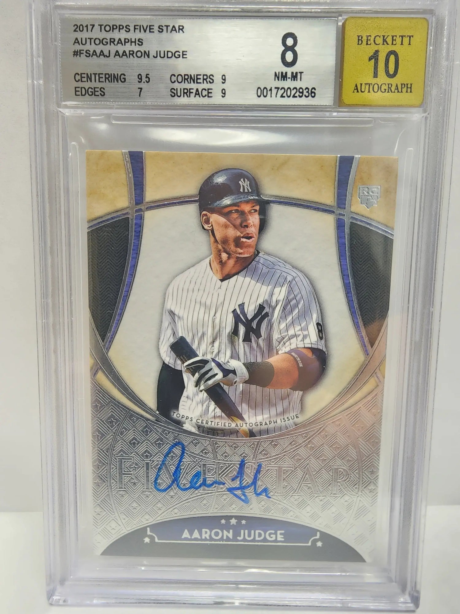 This is a 2017 topps five star autographed baseball card featuring aaron judge in his pinstriped new york yankees uniform, signed with blue ink and encased in a protective beckett grading slab.