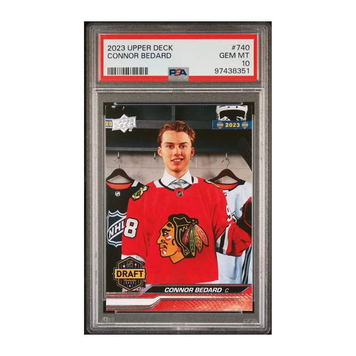 Hockey card featuring connor bedard in a white and red uniform with the number 98, holding an ice hockey stick.