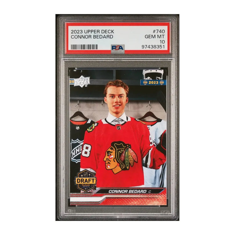 Hockey card featuring connor bedard in a white and red uniform with the number 98, holding an ice hockey stick.
