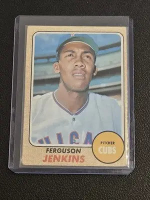 A vintage 1960s baseball trading card featuring ferguson jenkins in a white uniform with blue trim, encased in clear protective plastic.