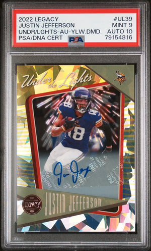 A 2022 legacy justin jefferson football trading card, featuring a holographic design with gold and silver geometric patterns around the player’s image in his blue minnesota vikings uniform.