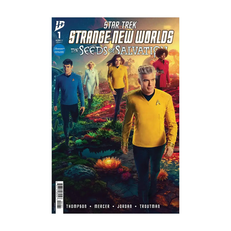Star trek: strange new worlds comic book cover featuring characters in starfleet uniforms walking through a vibrant alien landscape.