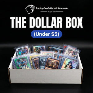 White cardboard box filled with assorted trading cards in clear protective sleeves.