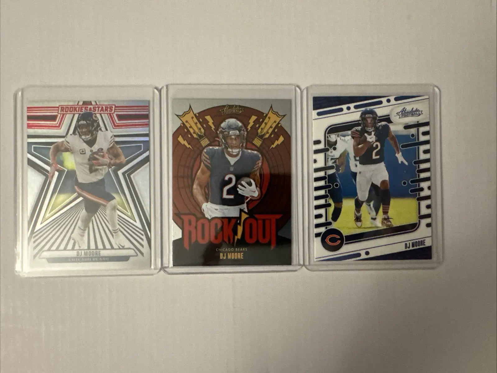 Chicago Bears trading cards featuring William Perry and Devin Hester in protective cases