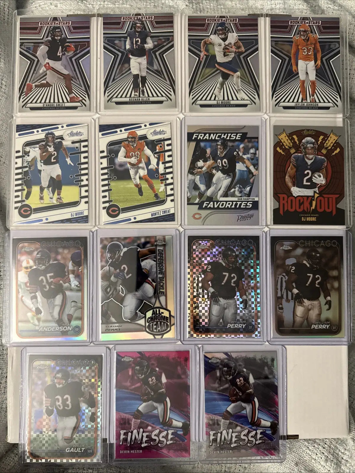 American football trading cards featuring Chicago Bears players William Perry Devin Hester in protective cases