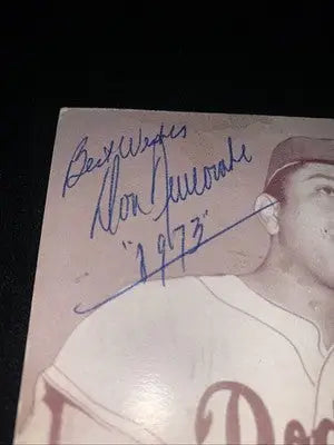 Vintage Brooklyn Dodgers trading card featuring Don Newcombe autograph and 1973 signature