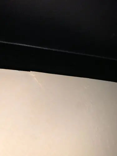 White surface with a crack on a Boston Red Sox autographed photo pack