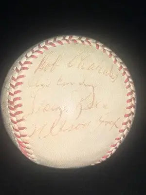 Vintage Chicago White Sox signed baseball with faded red stitching and autographs