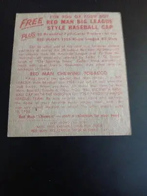 1955 Red Man Tobacco - AL #7 Jim Hegan. Cleveland. w/tab. surface damage. PR-GD