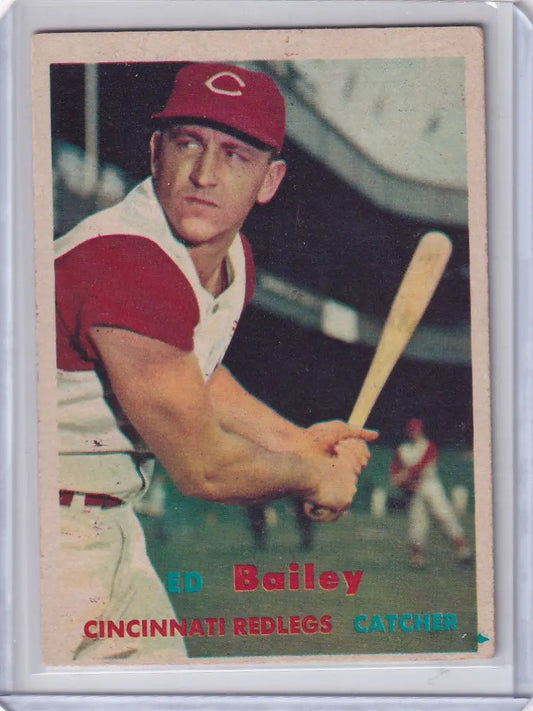 Vintage 1957 Topps Baseball card of J.D. Bailey Cincinnati Reds catcher in protective sleeve