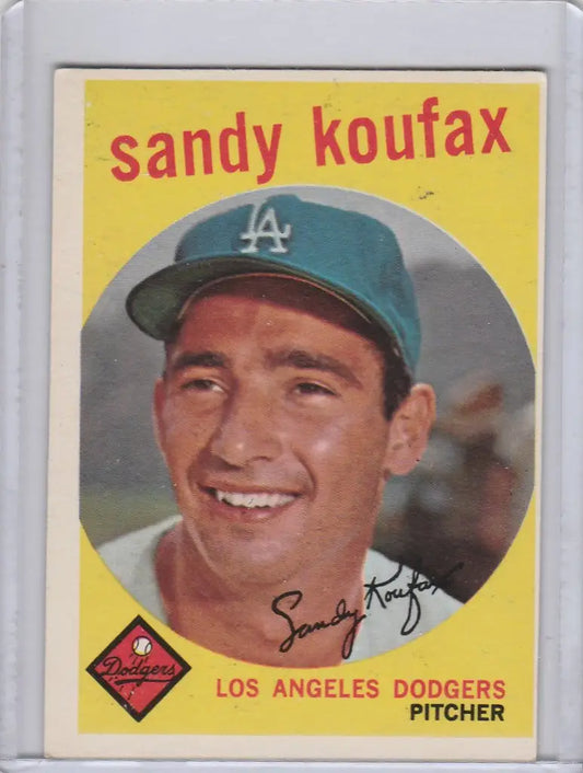 Baseball card of Sandy Koufax, smiling Los Angeles Dodgers pitcher in blue cap