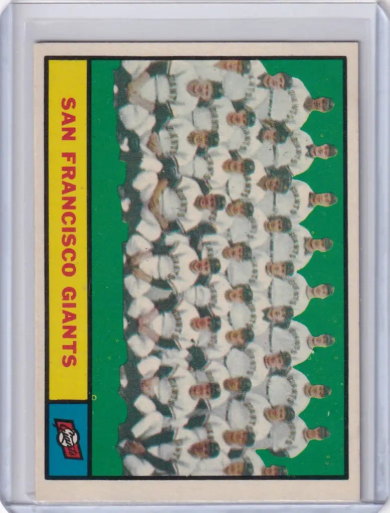 1961 Topps #167 San Francisco Giants Team card featuring players in white uniforms