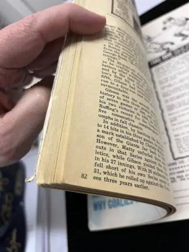 Open aged book showcasing 1968 Lou Brock Auto Dell Sports Magazine BAS Beckett Cardinals