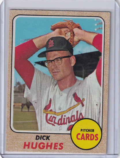 Baseball card of Dick Hughes in wind-up pose for Topps Baseball, St. Louis Cardinals