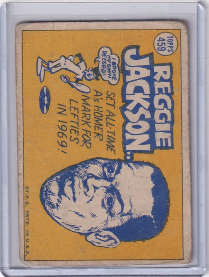 Vintage Topps Baseball card of Reggie Jackson, Oakland Athletics, on yellow background
