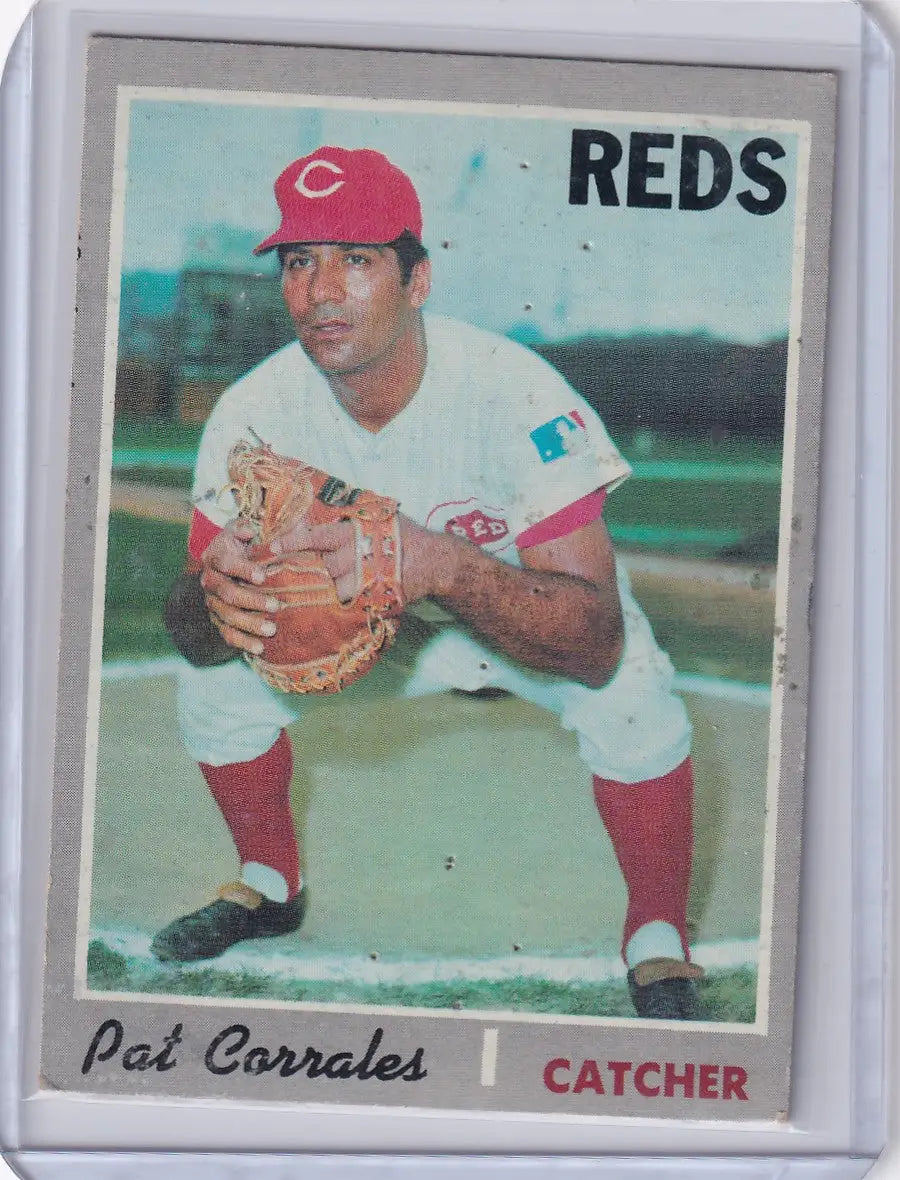 Vintage Topps Baseball card of Pat Corrales, Cincinnati Reds catcher in red and white uniform