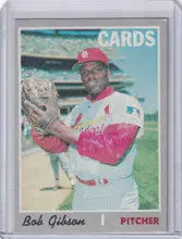 Baseball card of Bob Gibson in a pink and white St. Louis Cardinals uniform, Topps Baseball