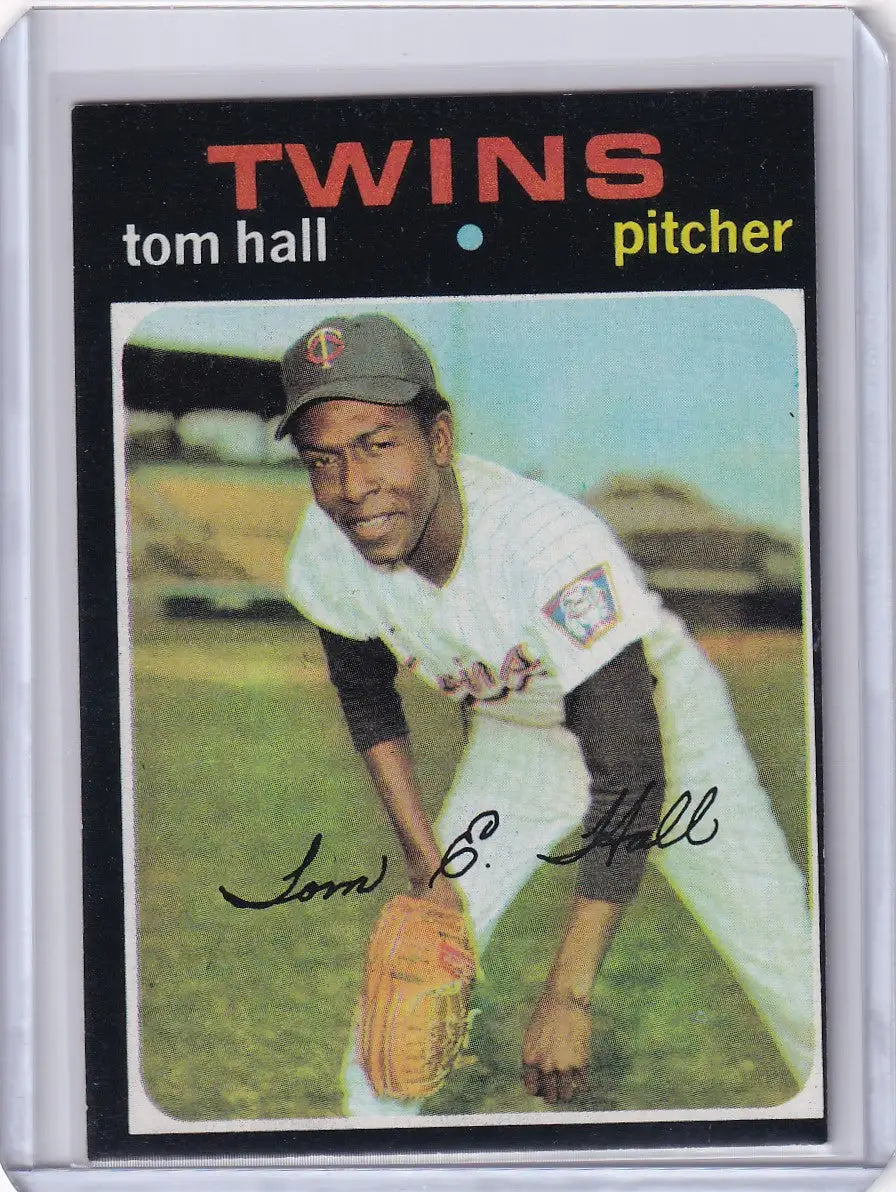 Baseball card of Tom Hall in a white uniform for Topps Baseball and Minnesota Twins