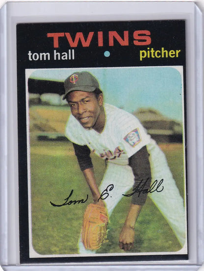 Baseball card of Tom Hall in a white uniform for Topps Baseball and Minnesota Twins