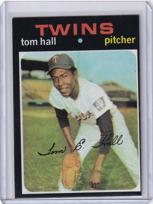 Baseball card of Tom Hall in a white uniform for Topps Baseball and Minnesota Twins