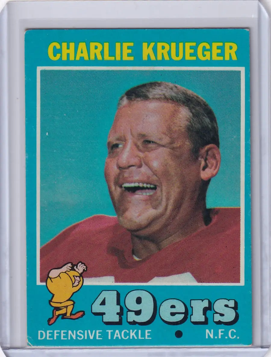 Vintage Topps Football card of Charlie Krueger, smiling player from San Francisco 49ers