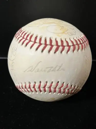 Autographed baseball with red stitching featuring 1976 LA Dodgers team signatures, including Steve Garvey