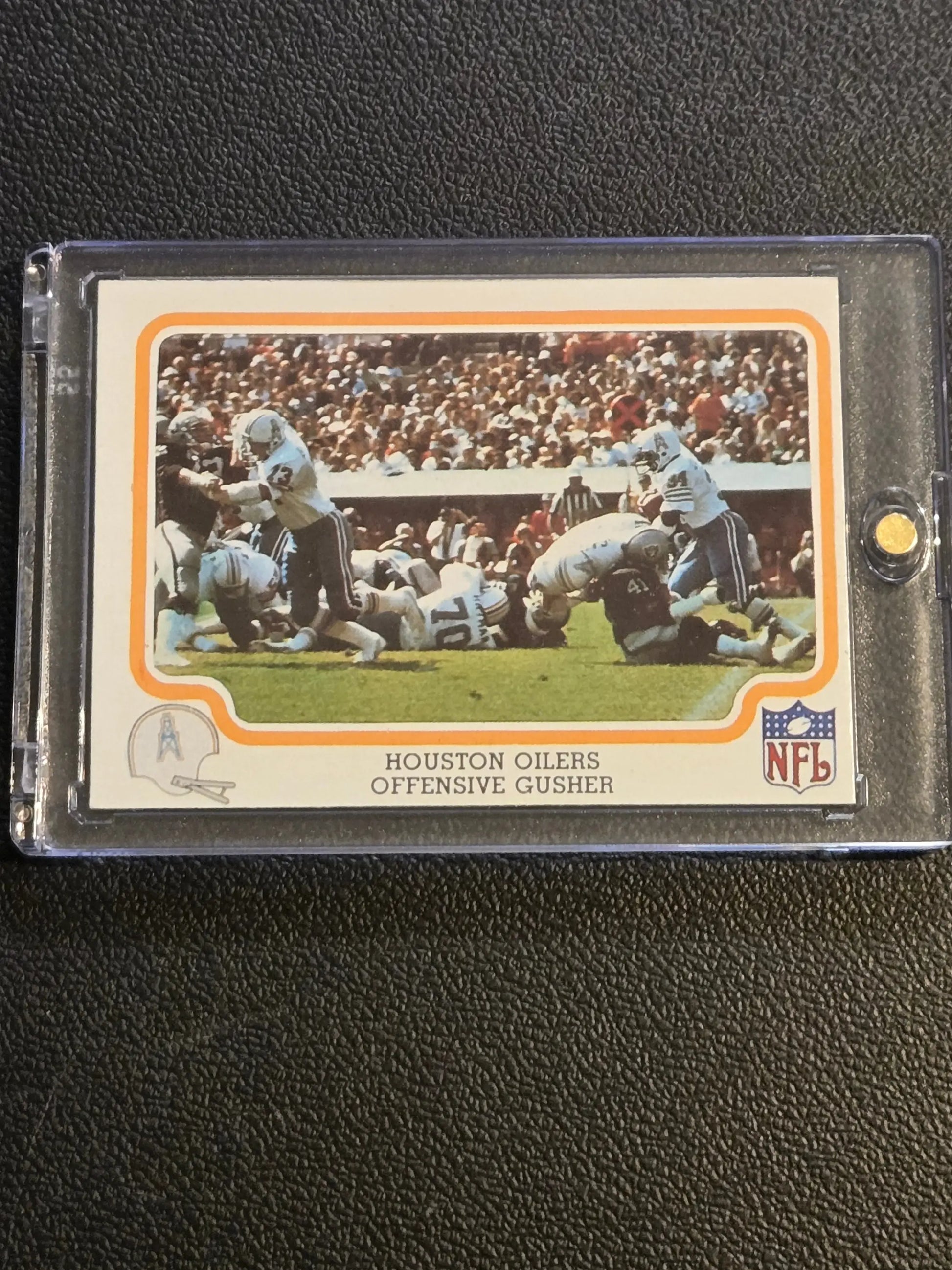 Vintage Houston Oilers Offensive Gusher NFL trading card in protective case, 1979 Fleer Team Action