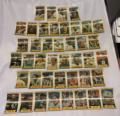 Vintage NFL football stars trading cards from the 1980 Stop N Go 3-D partial card set