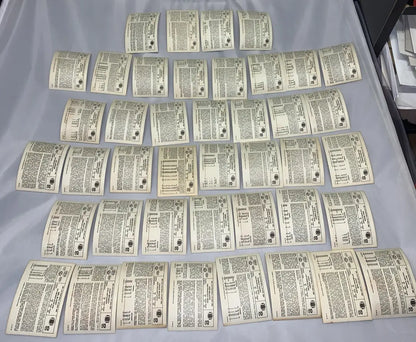 Light-colored paper cards with printed text and NFL Football Stars graphics from a partial card set