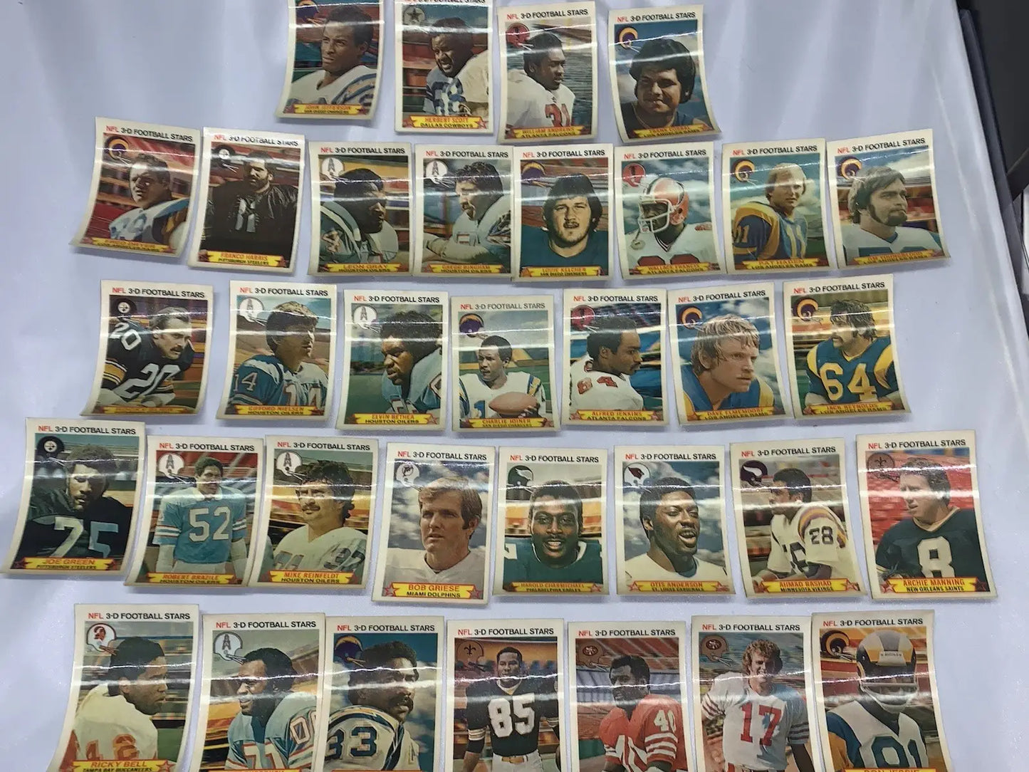 Vintage NFL football stars trading cards from the 1980 Stop N Go partial card set