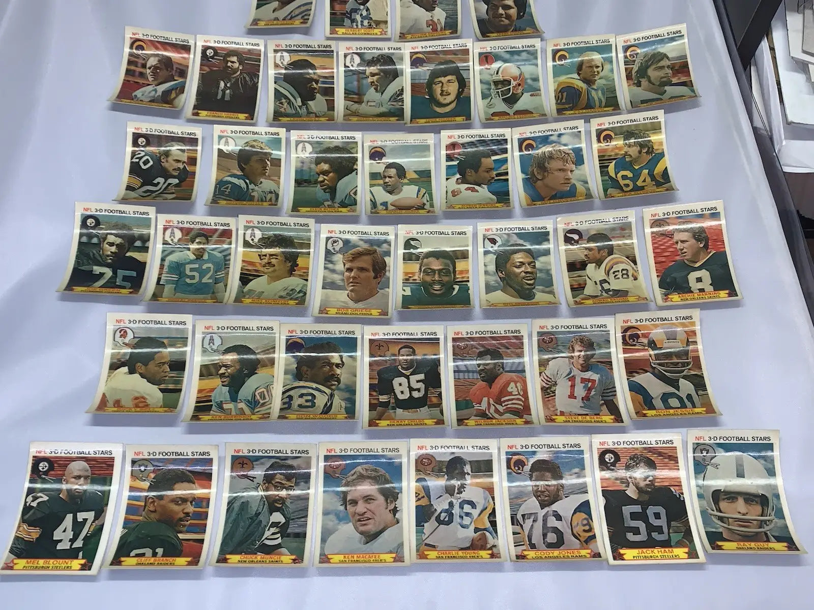 NFL football stars trading cards from the 1980 Stop N Go 3-D partial card set