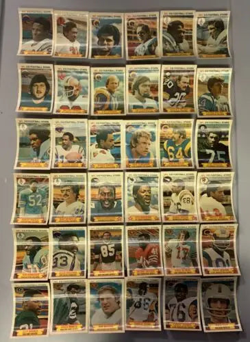 Collection of vintage NFL Football Stars 1980 Stop N Go partial card set display