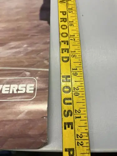 Yellow measuring tape on 1981-82 York Knicks Converse advertising poster