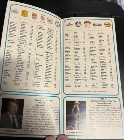 Vintage NBA schedule booklet pamphlet featuring Kareem Abdul-Jabbar and Moses Malone