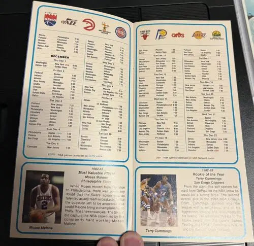 Vintage NBA schedule booklet featuring legends Kareem Abdul-Jabbar and Moses Malone