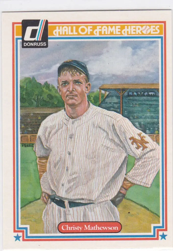 Baseball card of Christy Mathewson in white pinstriped uniform on the field