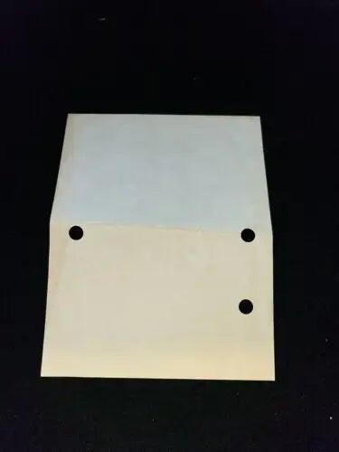 Off-white metal plate with three holes from 1984 New York Yankees Spring Training Press Pass