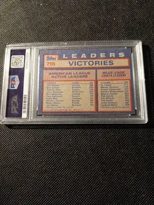 1984 Topps #715 AL Win Leaders (Jim Palmer / D. Sutton / T. John). PSA 7 NRMT - Baseball Card Single