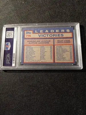 1984 Topps #715 AL Win Leaders (Jim Palmer / D. Sutton / T. John). PSA 7 NRMT - Baseball Card Single