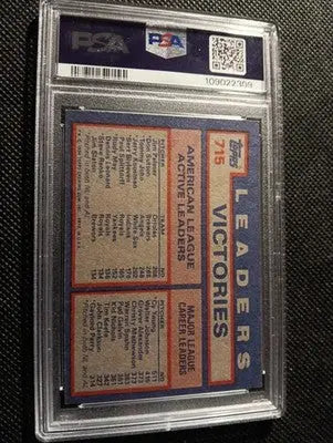 1984 Topps #715 AL Win Leaders (Jim Palmer / D. Sutton / T. John). PSA 7 NRMT - Baseball Card Single