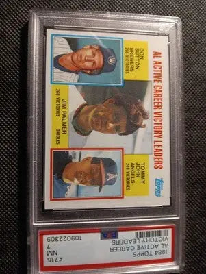 1984 Topps #715 AL Win Leaders (Jim Palmer / D. Sutton / T. John). PSA 7 NRMT - Baseball Card Single