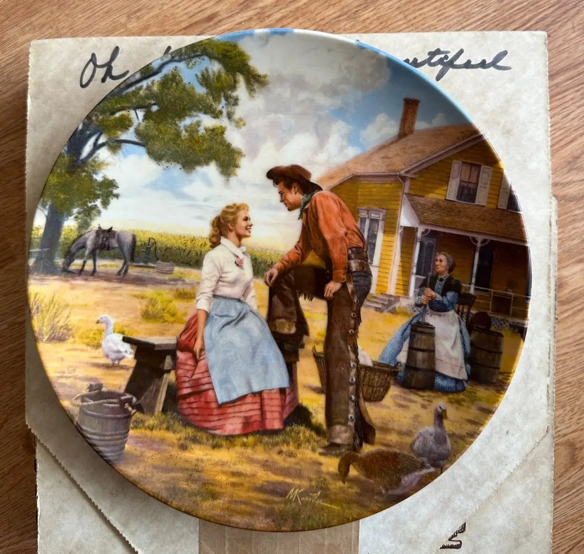 Decorative Bradford Exchange collector’s plate featuring a Western-themed romantic scene